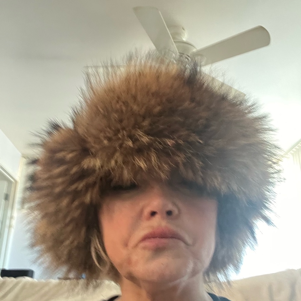Fur leather trapper hat.